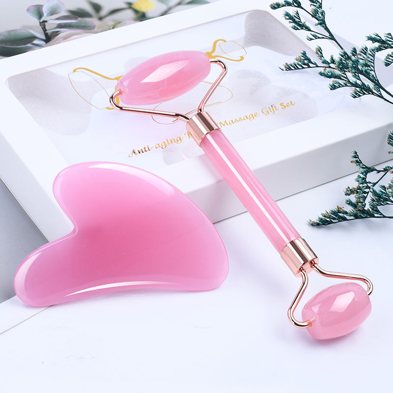 Pink Resin Face massager roller set with Guasha, for anti aging, and skin rejuvenation.