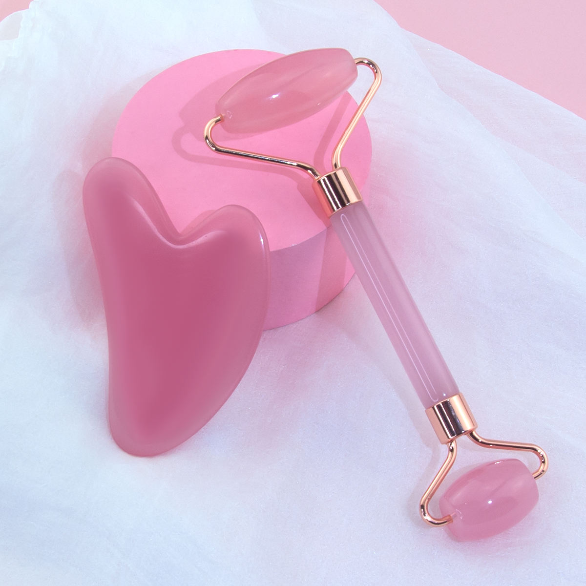 Pink Resin Face massager roller set with Guasha, for anti aging, and skin rejuvenation.