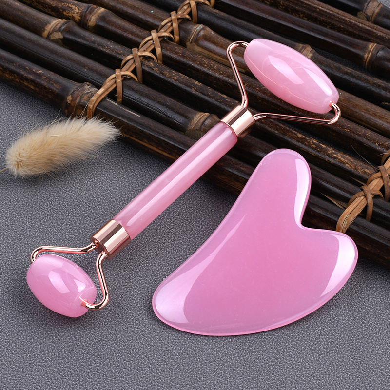 Pink Resin Face massager roller set with Guasha, for anti aging, and skin rejuvenation.